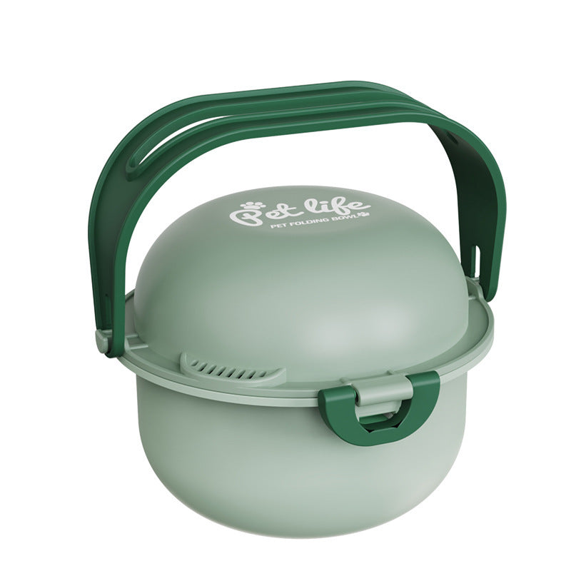 Dog eating from portable travel bowl at campsite outdoors