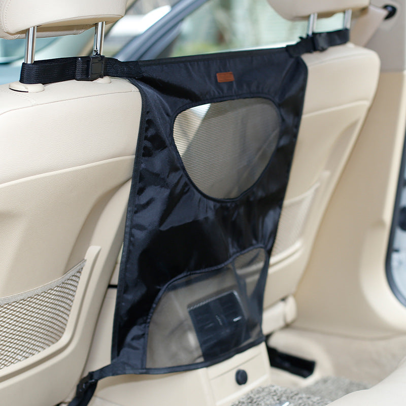 Grey pet car barrier installed in rear seat of SUV